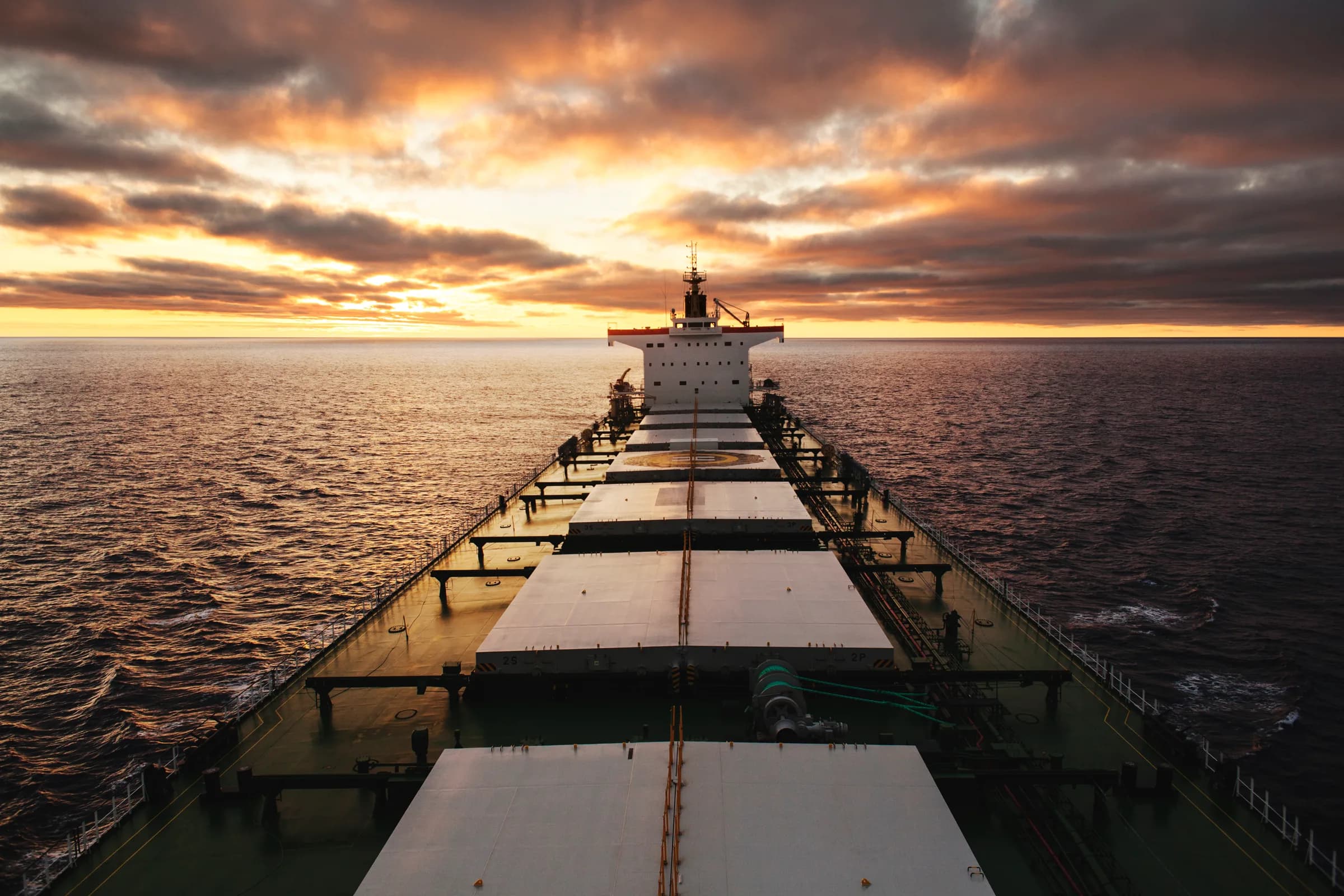 Bulk carrier on the open sea at sunset